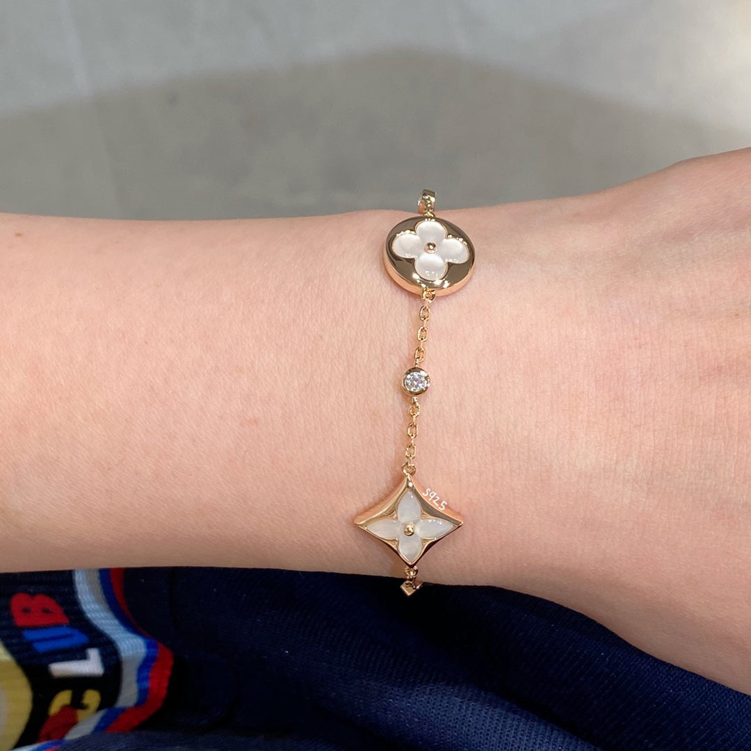 ¡®Star¡¯STAR AND SUN 4 MOTIF WHITE MOP PINK GOLD BRACELET